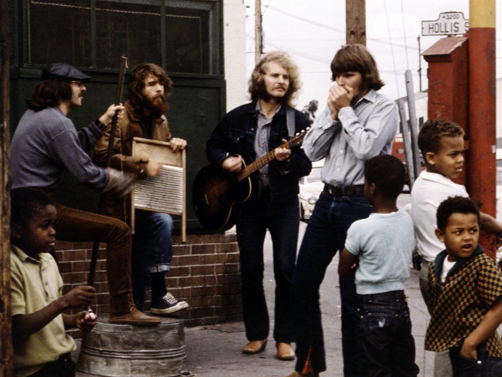 The members of Creedence Clearwater Revival during a street performance and photo shoot in Oakland, Calif. for the band's Willy and the Poor Boys album, also released in 1969. Michael Ochs Archives/Getty Images