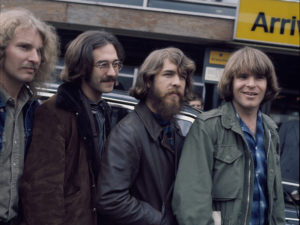 The original lineup of Creedence Clearwater Revival, at London's Heathrow Airport. L-R: Tom Fogerty, Stu Cook, Doug Clifford, John Fogerty. CREDIT: Michael Putland/Getty Images