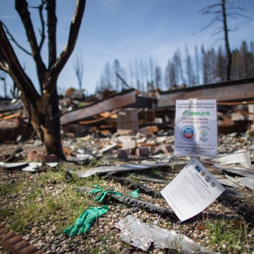 A mobile home park destroyed by last year's wildfire in Paradise, California. Those rebuilding homes and lives say they're getting contradictory messages about whether the water is safe to drink. CREDIT: Meredith Rizzo/NPR