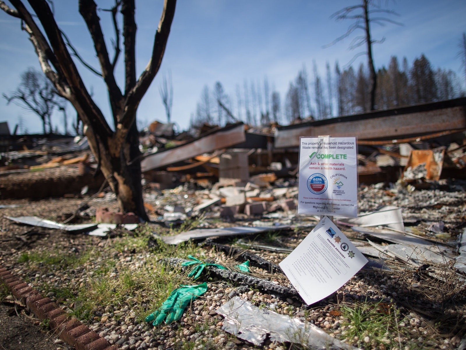 A mobile home park destroyed by last year's wildfire in Paradise, California. Those rebuilding homes and lives say they're getting contradictory messages about whether the water is safe to drink. CREDIT: Meredith Rizzo/NPR