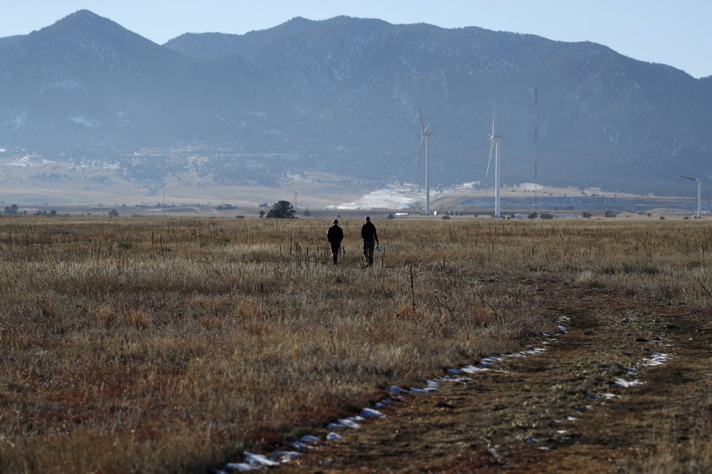 hikers head down a trail in the Rocky Flats National Wildlife Refuge in Broomfield, Colo. The former nuclear weapons plant northwest of Denver opened to hikers and cyclists in September 2018, but some activists question whether it’s safe. CREDIT: DAVID ZALUBOWSKI / AP