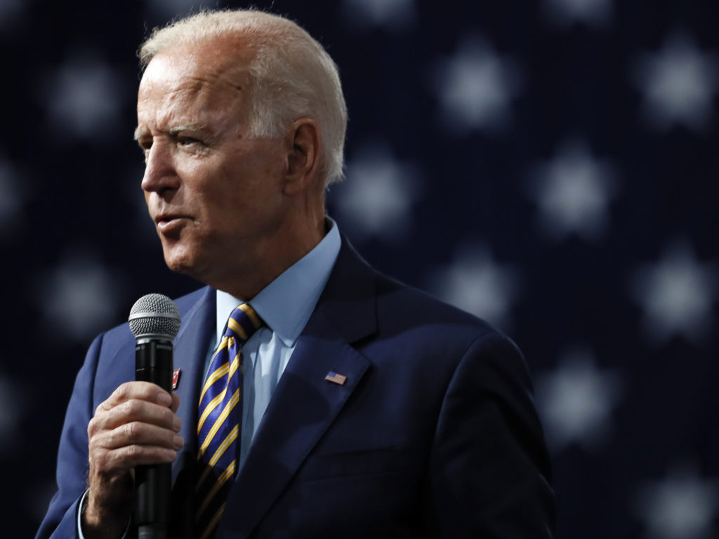 Former Vice President Joe Biden says if he's elected, he'd support a new ban on assault weapons, along with a buyback program. Charlie Neibergall/AP