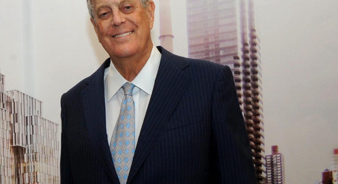 David Koch with a rendering of The David H. Koch Center for Cancer Care in 2015. The billionaire underwrote both old-fashioned charitable causes and the conservative movement, reshaping U.S. politics. Diane Bondareff/Invision for Koch Industries