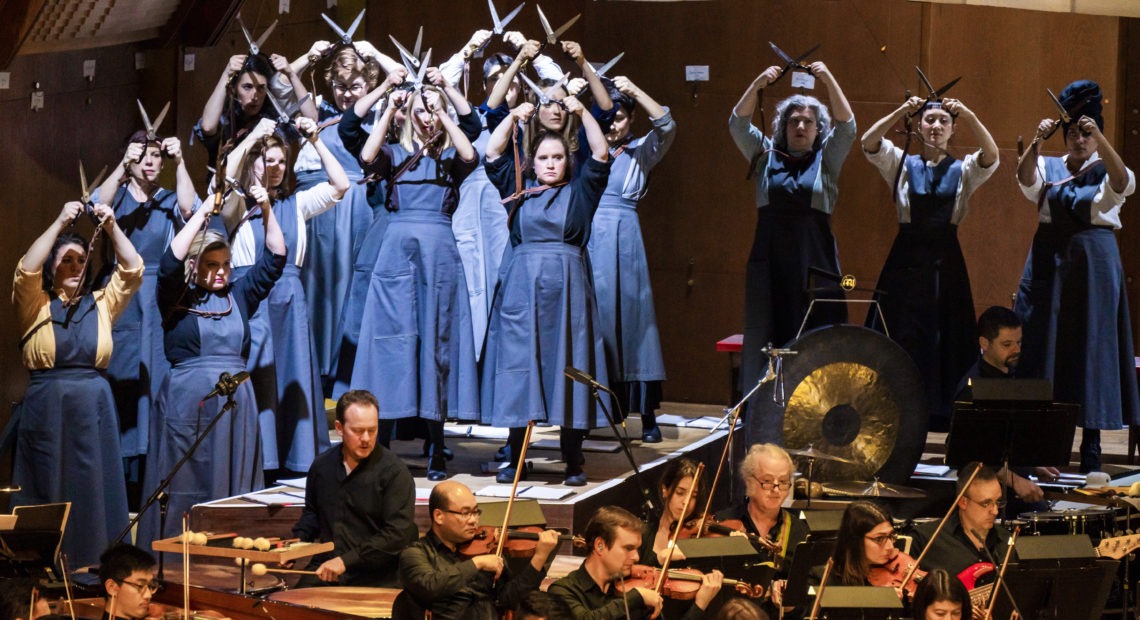 Members of the 146-voice chorus, dressed as garment workers, in composer Julia Wolfe's Fire In My Mouth, which documents the 1911 Triangle Shirtwaist Factory Fire in New York. CREDIT: Chris Lee/Decca Gold