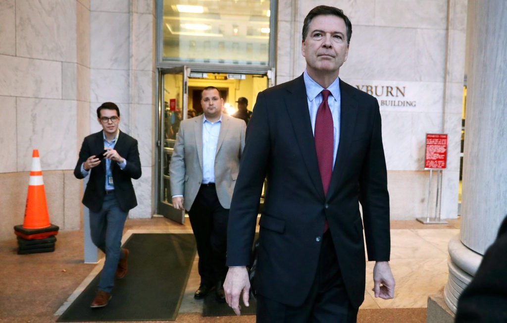 Former FBI Director James Comey leaves the Rayburn House Office Building after testifying to the House judiciary and oversight committees on Capitol Hill on Dec. 7, 2018. Chip Somodevilla/Getty Images