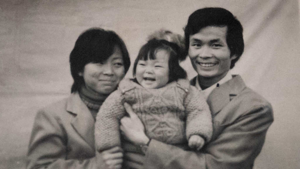 Director Nanfu Wang's One Child Nation documentary draws on her own family's experience with the restrictive policy. She's pictured here as a child with her parents. Amazon Studios
