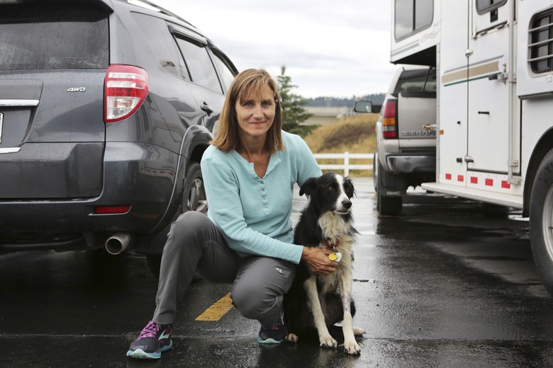 Carole King of Deer Park, Washington, holding her border collie, Katie, who went missing for 57 days before she was found in Kalispell, Montana. CREDIT: Mackenzie Reiss/Daily Inter Lake via AP