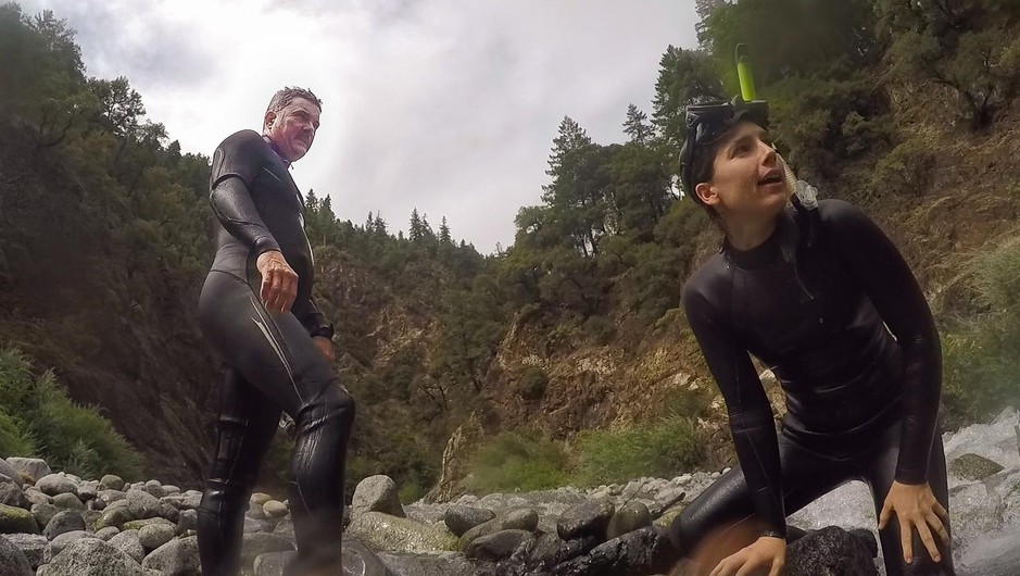 Craig Tucker and Amy Fingerle take a break from snorkling on the Salmon River. This is the last stronghold of wild spring chinook in the Klamath Basin, but on 161 fish were counted this year. CREDIT: Jes Burns/OPB