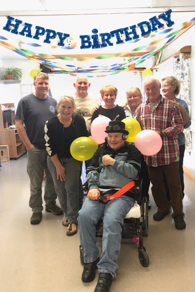 Gregory Paul is pictured with his siblings during his 65th birthday party at the Rainier School two years ago. COURTESY OF MARYANN BROOKHART