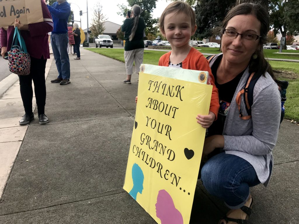 Phoebe Constance, 4, stands with her mother, Andrea. “I wanted to show her what’s possible as a citizen of this country,” Andrea said. CREDIT: Courtney Flatt/NWPB