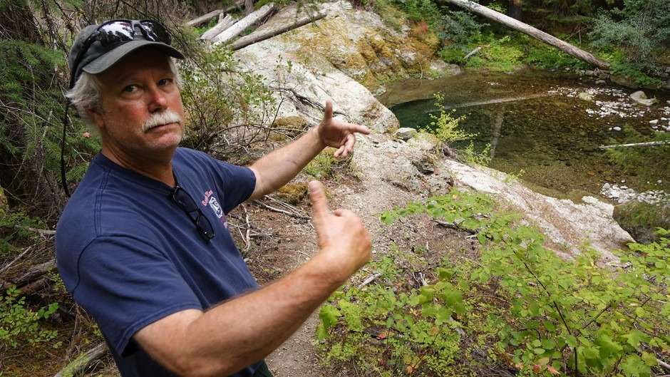 USFS biologist Casey Baldwin stands just downstream of a restoration project that creates gravel for spawning spring chinook on the South Umpqua. Jes Burns/OPB