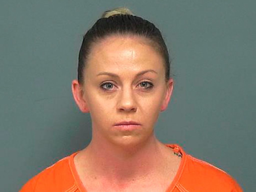 Amber Guyger, the former Dallas police officer who fatally shot an unarmed black man in his own home told a 911 dispatcher, "I thought it was my apartment" several times as she waited for emergency responders to arrive. Guyger is charged in the September, 2018 killing of Botham Jean. Mesquite Police Department via AP