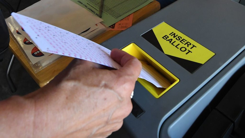 ballot into scanner