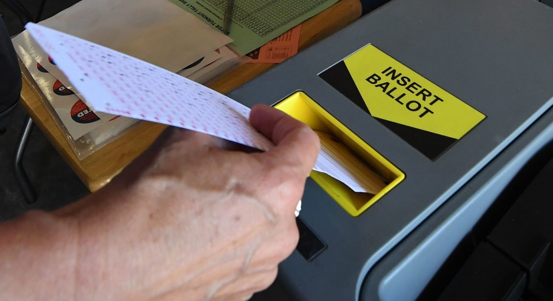 ballot into scanner