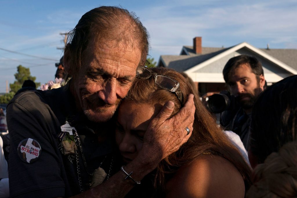 Antonio Basco, husband of El Paso Walmart shooting victim Margie Reckard, hugs an attendee during his wife's visitation service in El Paso, Texas, in August. Paul Ratje/AFP/Getty Images