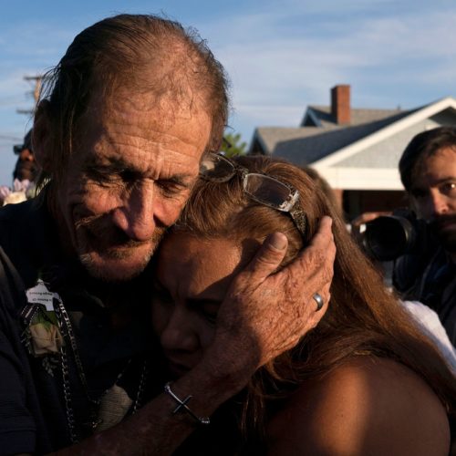 Antonio Basco, husband of El Paso Walmart shooting victim Margie Reckard, hugs an attendee during his wife's visitation service in El Paso, Texas, in August. Paul Ratje/AFP/Getty Images