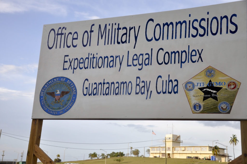 A sign is posted in front of the war crimes court at the U.S. naval base at Guantánamo Bay, Cuba, on Oct. 14, 2012. CREDIT: Michelle Shepard/Bloomberg via Getty Images