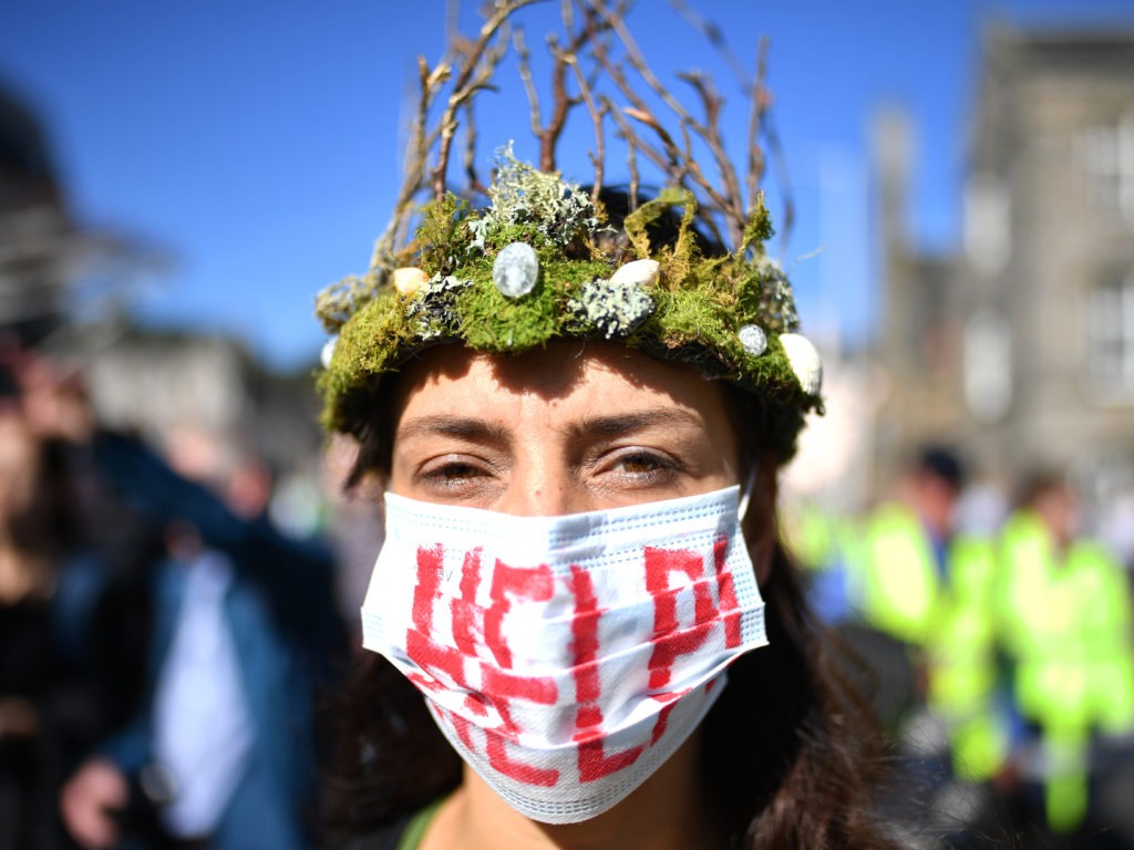 The Global Climate Strike drew scores of protesters around the world Friday, as young people answered a call from activist Greta Thunberg to demand action on climate change. Here, a protester attends a rally in Edinburgh, Scotland. CREDIT: Jeff J Mitchell/Getty Images