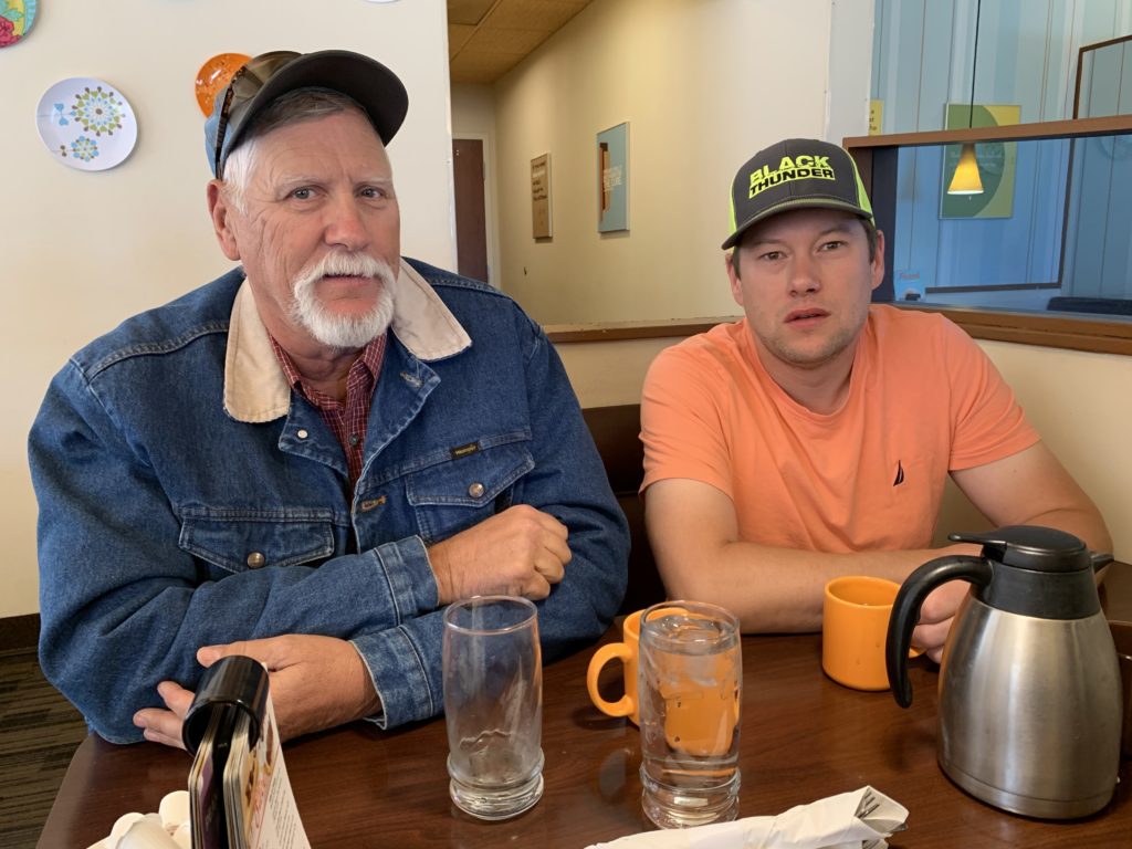 Ty Cordingly and his dad at a local Gillette diner. He's seen coworkers leave the state for jobs and thinks Wyoming relies too much on the energy industry. Cooper McKim/Wyoming Public Media