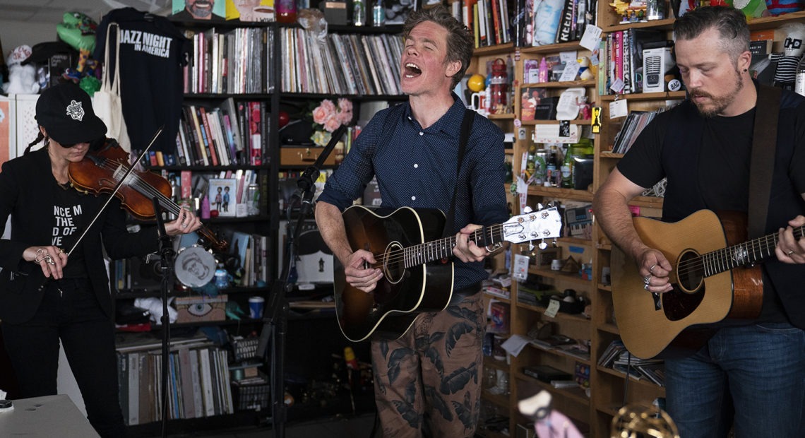 Josh Ritter (center) performs with Amanda Shires and Jason Isbell at a Tiny Desk Concert on Aug. 27, 2019. CREDIT: Emily Bogle/NPR