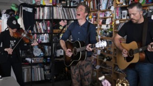 Josh Ritter (center) performs with Amanda Shires and Jason Isbell at a Tiny Desk Concert on Aug. 27, 2019. CREDIT: Emily Bogle/NPR