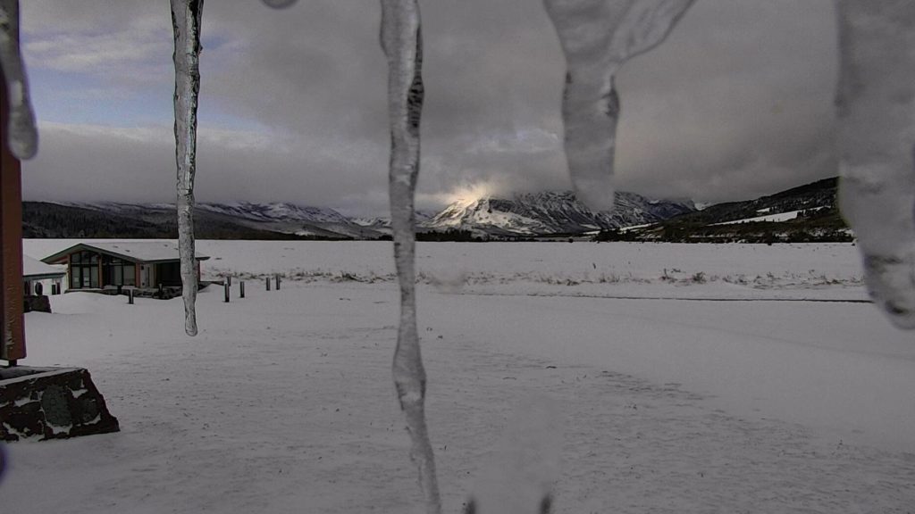 Parts of Montana were hit with more than 2 feet of snow over the weekend, the National Weather Service says. Here, a Glacier National Park webcam shows the sun trying to reach the peaks at the St. Mary Visitor Center, near the Blackfeet Reservation. Glacier National Park webcam/National Park Service