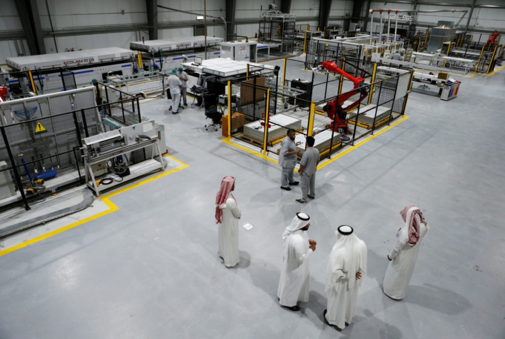 Workers are seen at the solar plant factory in Uyayna, north of Riyadh, Saudi Arabia April 10, 2018. CREDIT: Faisal Al Nasser/Reuters