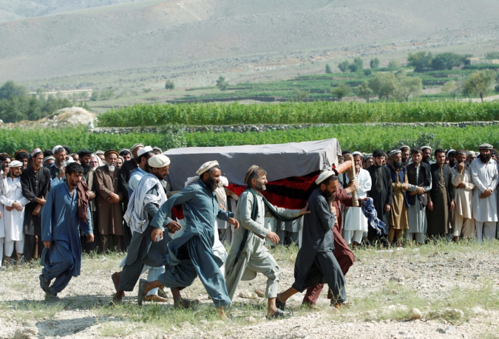 Men carry a coffin of one of the victims after a drone strike, in Khogyani district of Nangarhar province, Afghanistan September 19, 2019. CREDIT: Parwiz/Reuters