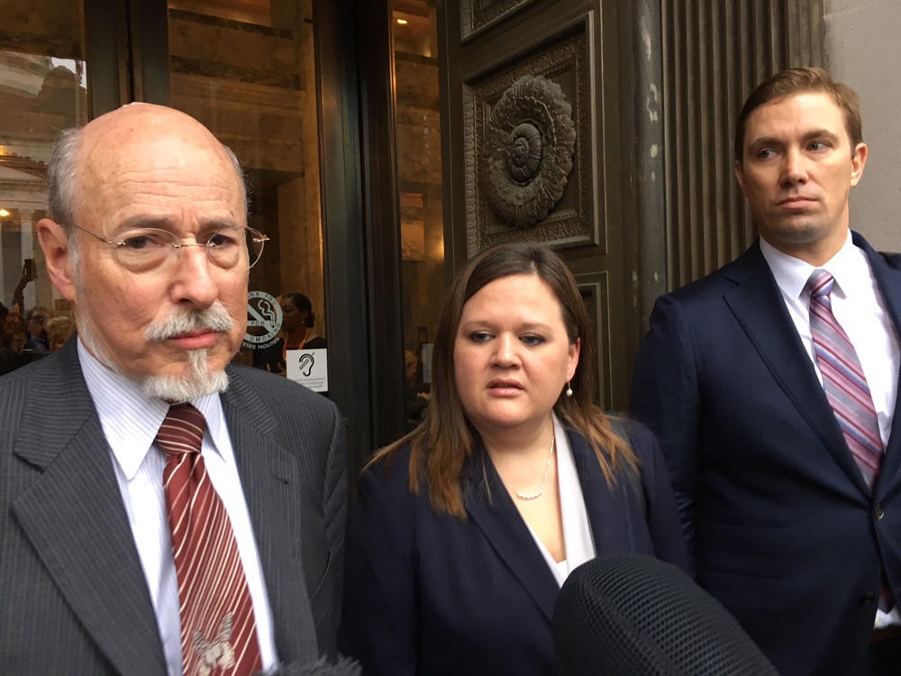 In this file photo from November 2017, former prison inmate turned honors law school graduate Tarra Simmons and her attorneys speak with reporters following a Washington Supreme Court hearing to consider her eligibility to sit for the state bar exam. CREDIT: Austin Jenkins/N3