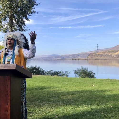 JoDe Goudy, chairman of the Yakama Nation, speaks with the Columbia River in the background near The Dalles, Oregon, on Monday, Oct. 14, 2019, where Celilo Falls, an ancient salmon fishing site was destroyed by the construction of the Dalles Dam in the 1950s. CREDIT: Gillian Flaccus/AP