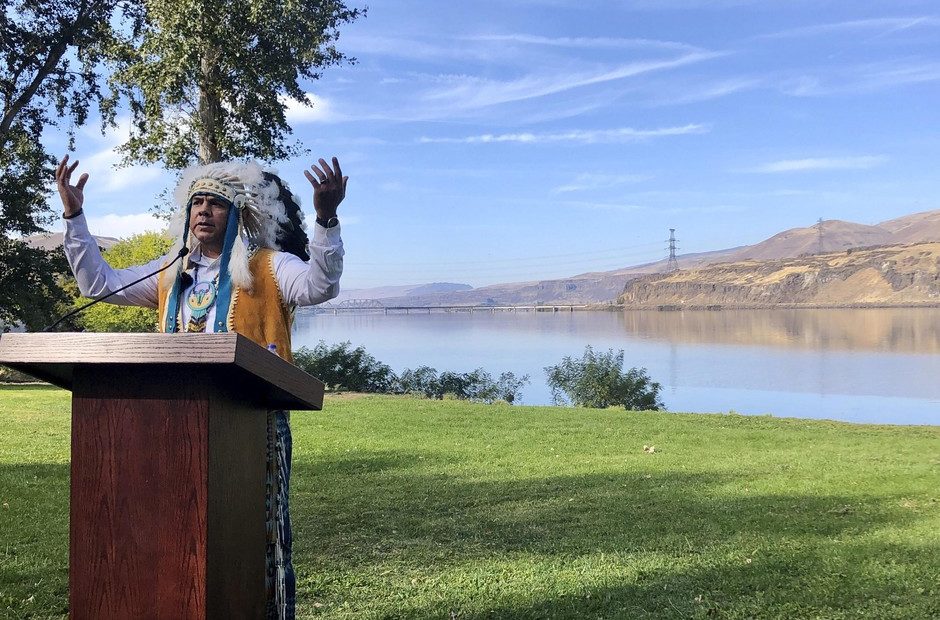 JoDe Goudy, chairman of the Yakama Nation, speaks with the Columbia River in the background near The Dalles, Oregon, on Monday, Oct. 14, 2019, where Celilo Falls, an ancient salmon fishing site was destroyed by the construction of the Dalles Dam in the 1950s. CREDIT: Gillian Flaccus/AP