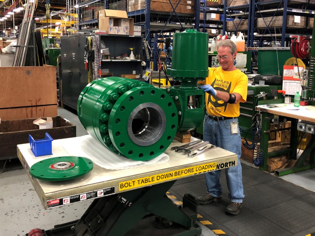 A worker assembles an industrial valve at Emerson Electric Co.'s factory in Marshalltown, Iowa. The manufacturing sector has seen a slowdown amid the ongoing trade war. CREDIT: Tim Aeppel/Reuters