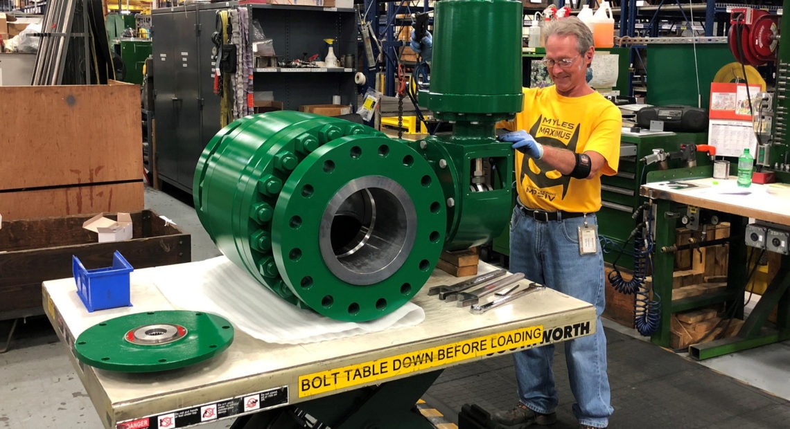 A worker assembles an industrial valve at Emerson Electric Co.'s factory in Marshalltown, Iowa. The manufacturing sector has seen a slowdown amid the ongoing trade war. CREDIT: Tim Aeppel/Reuters