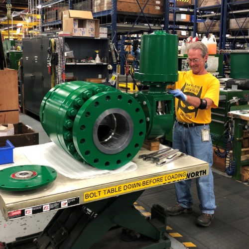 A worker assembles an industrial valve at Emerson Electric Co.'s factory in Marshalltown, Iowa. The manufacturing sector has seen a slowdown amid the ongoing trade war. CREDIT: Tim Aeppel/Reuters