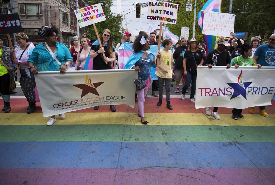 The Trans Pride Seattle march crosses Broadway Street on Friday, June 22, 2018, near Cal Anderson Park in Capitol Hill. CREDIT: Megan Farmer/KUOW