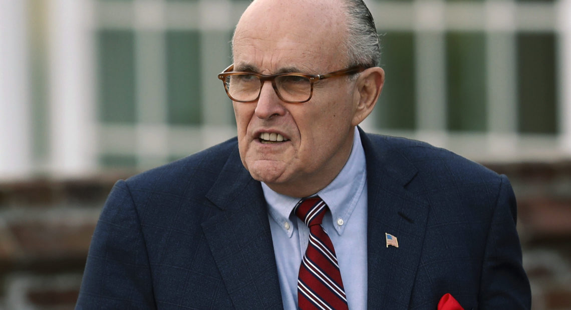 Associates of President Trump's personal lawyer Rudy Giuliani, pictured in May 2018, have been arrested on campaign finance charges. CREDIT: Carolyn Kaster/AP