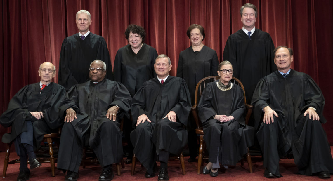 The Supreme Court justices, pictured in November 2018, start a new term on Monday. CREDIT: J. Scott Applewhite/AP
