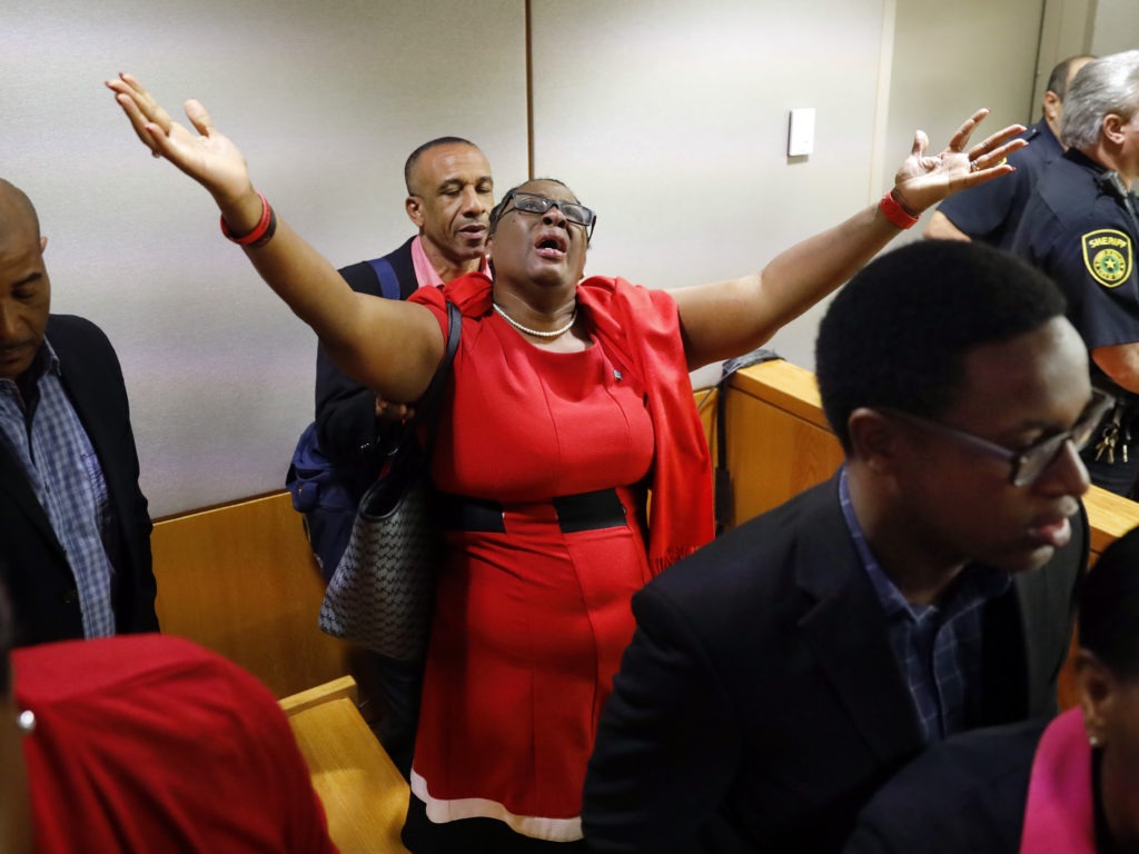 Botham Jean's mother, Allison Jean, rejoices in the courtroom after fired Dallas police Officer Amber Guyger was found guilty of murder. Tom Fox/The Dallas Morning News via AP