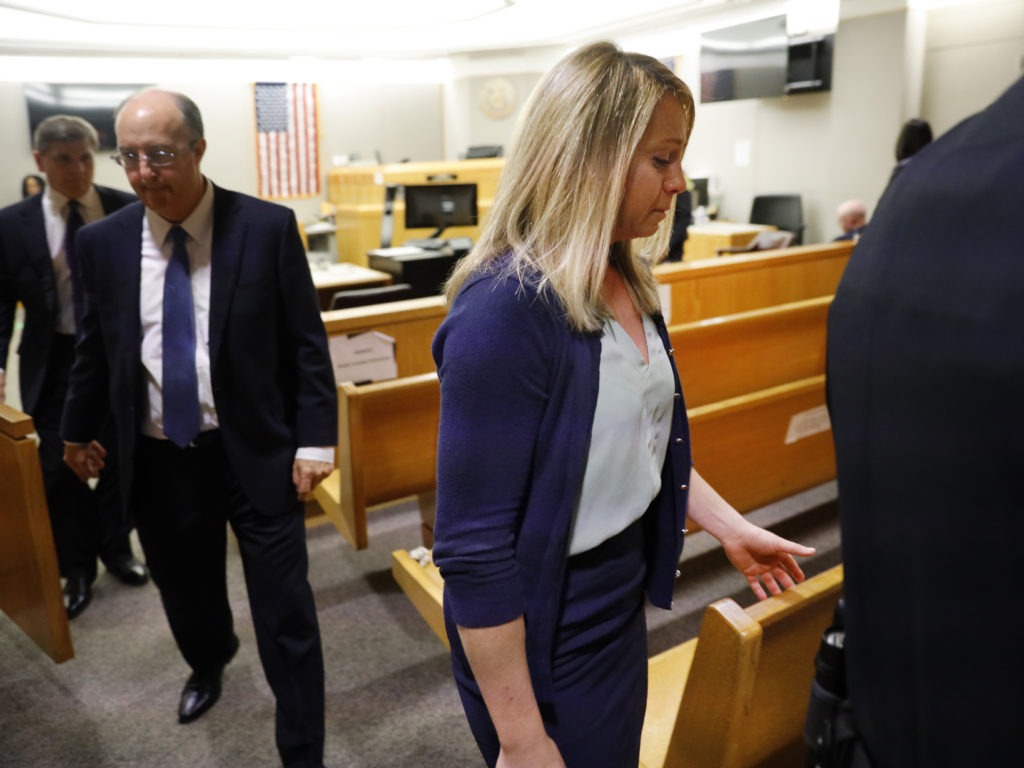 Fired Dallas police Officer Amber Guyger leaves the courtroom after a jury found her guilty of murder Tuesday. Guyger shot and killed Botham Jean, an unarmed 26-year-old neighbor, in his own apartment last year. She told police she thought his apartment was her own and that he was an intruder. CREDIT: Tom Fox/The Dallas Morning News via AP