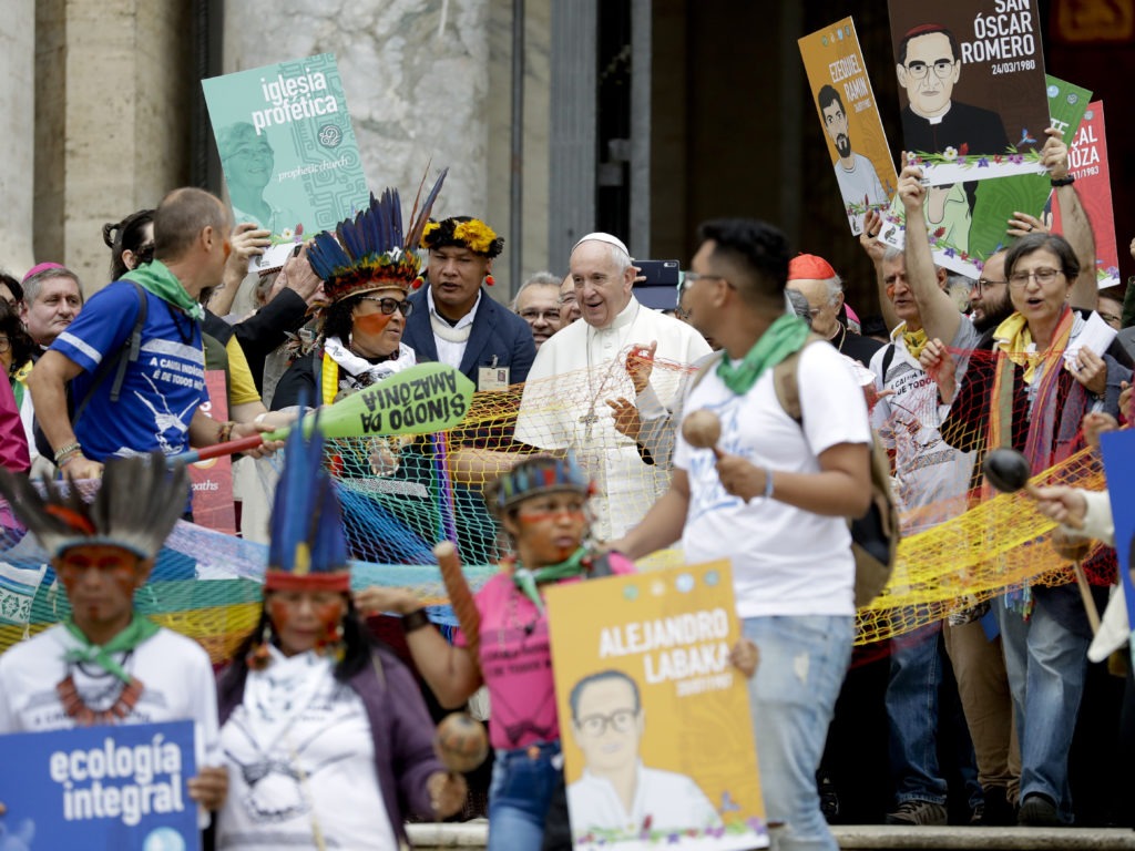 Pope Francis walks in procession on the occasion of the Amazon synod at the Vatican on Monday. The pope opened a three-week meeting as he fended off attacks from conservatives who are opposed to his ecological agenda. CREDIT: Andrew Medichini/AP