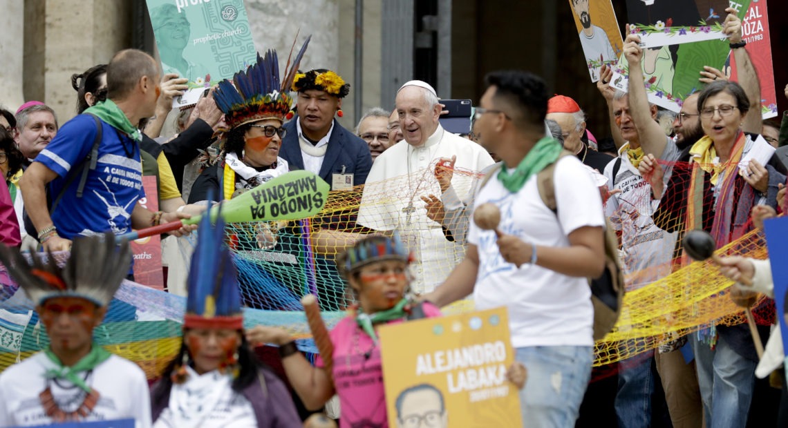 Pope Francis walks in procession on the occasion of the Amazon synod at the Vatican on Monday. The pope opened a three-week meeting as he fended off attacks from conservatives who are opposed to his ecological agenda. CREDIT: Andrew Medichini/AP
