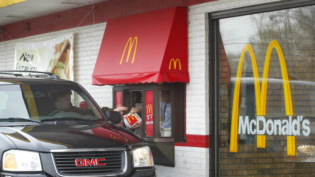 More cities are passing legislation to ban the construction of drive-through windows in an attempt to curb emissions, reduce litter and improve pedestrian safety. The bans are also sometimes touted as a way to help fight obesity, but past studies suggest they don't have that effect. Tim Boyle/Getty Images