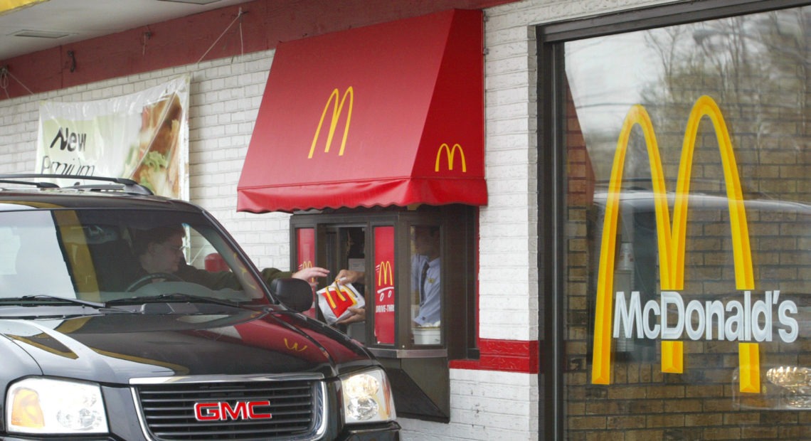 More cities are passing legislation to ban the construction of drive-through windows in an attempt to curb emissions, reduce litter and improve pedestrian safety. The bans are also sometimes touted as a way to help fight obesity, but past studies suggest they don't have that effect. Tim Boyle/Getty Images