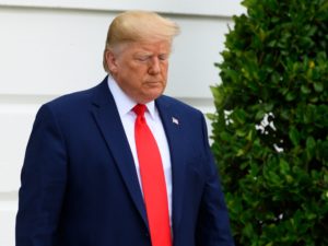 A federal judge in New York issued an injunction Friday against a Trump administration rule that would make it harder for low-income immigrants to get a green card. Trump is seen here leaving the White House last week.