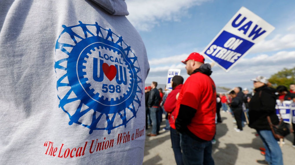 The UAW GM National Council will vote on a new tentative deal Thursday, in a potential end to the national strike that has idled GM plants. Here, union members and their families rallied near the General Motors Flint Assembly plant on Sunday. CREDIT: Bill Pugliano/Getty Images