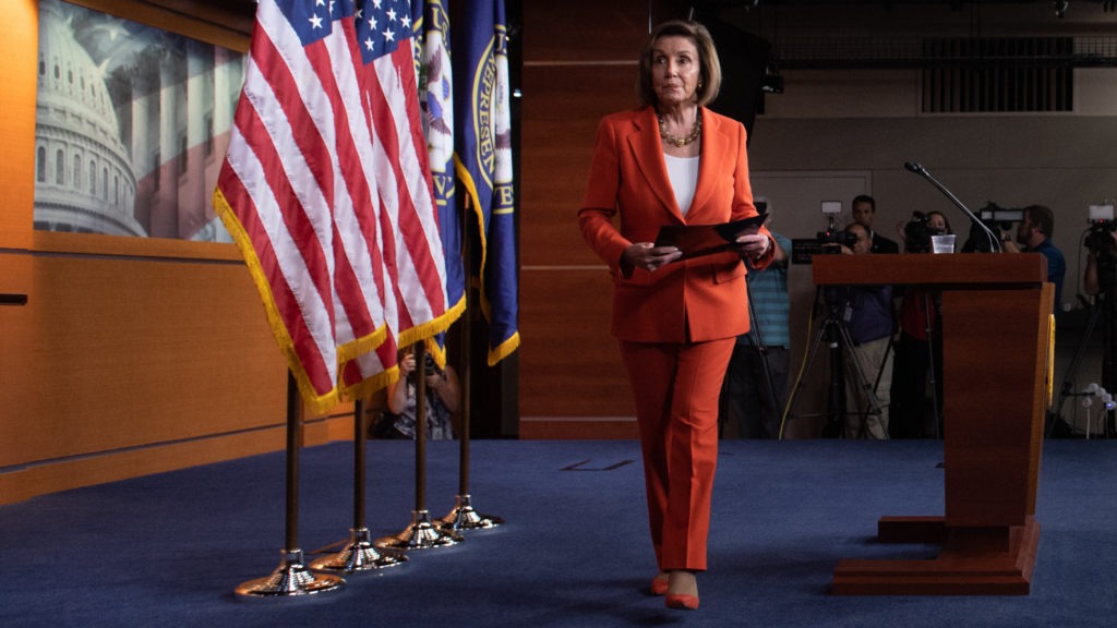 Speaker of the House Nancy Pelosi, D-Calif., leaves after speaking at her weekly press conference on Capitol Hill on Thursday as the House prepared to vote — then pass — a resolution formalizing its impeachment inquiry into President Trump. CREDIT: Saul Loeb/AFP via Getty Images