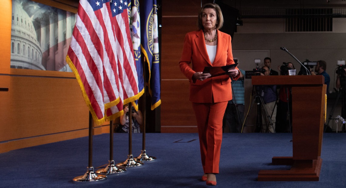 Speaker of the House Nancy Pelosi, D-Calif., leaves after speaking at her weekly press conference on Capitol Hill on Thursday as the House prepared to vote — then pass — a resolution formalizing its impeachment inquiry into President Trump. CREDIT: Saul Loeb/AFP via Getty Images