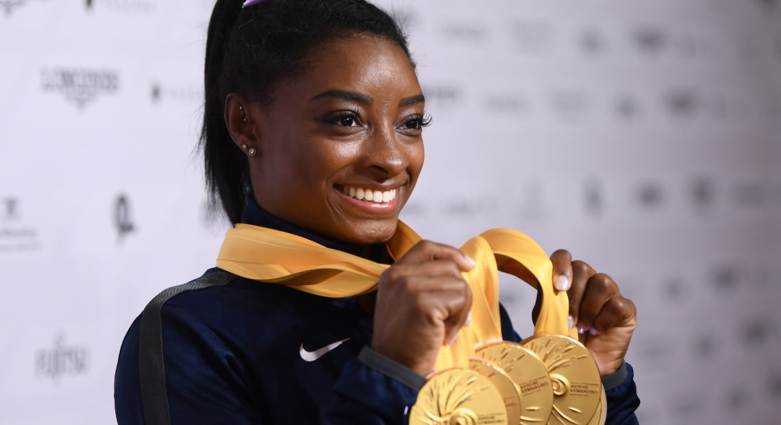 U.S. gymnast Simone Biles poses with her five gold meals at the 2019 World Championships in Stuttgart, Germany. With her wins, she becomes the most decorated gymnast ever at the world championships, with 25 total medals. Laurence Griffiths/Getty Images