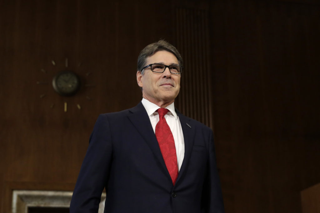 Former Texas Gov. Rick Perry takes a seat before the Senate Energy and Natural Resources Committee hearing on his nomination to be energy secretary on Jan. 19, 2017. CREDIT: Yuri Gripas/AFP/Getty Images