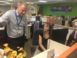 Thomas Ylijoa, a clinic director with National Jewish Health in Denver., chats with Nichole Lopez, a tobacco cessation coach for a program there. In July, the hospital launched "My Life, My Quit" a vaping cessation program aimed at teens. The program has a traditional phone helpline, but also offers coaching by text and chat.